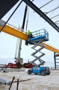 crew installing festooning on 6 ton crane - scissor lift