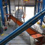 aerial view removing a heavy crane from a building